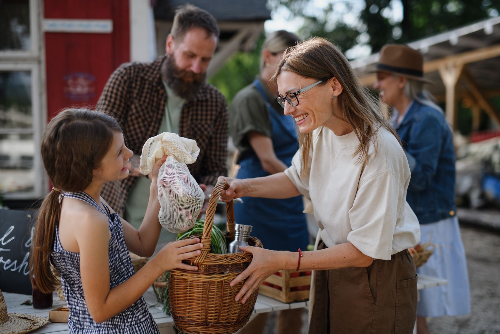 Mother and daughter shopping at farmers market
